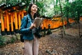 Elegant asian photographer holding her guidebook