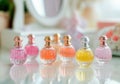 Elegant assorted perfume bottles on mirror with soft focus background Royalty Free Stock Photo