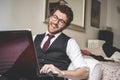 Elegant attractive fashion hipster man using notebook Royalty Free Stock Photo