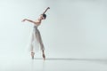 elegant ballerina dancing in studio