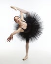 Elegant ballerina made a deflection. photo shoots in the studio on a white background