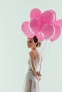 elegant ballerina in white dress with pink balloons Royalty Free Stock Photo