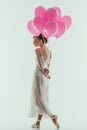 elegant ballet dancer in white dress with pink balloons Royalty Free Stock Photo