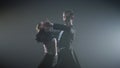 Elegant dancers showing professional skills in hall. Ballroom couple dancing. Royalty Free Stock Photo