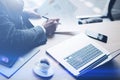 Elegant banking finance analyst working at sunny office on laptop while sitting at wooden table.Businessman analyze Royalty Free Stock Photo