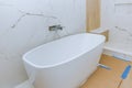 Elegant bathroom with bathtub in new home bathroom renovations Royalty Free Stock Photo