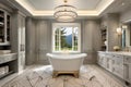 An elegant bathroom with a freestanding bathtub, large vanity mirror, and soft ambient lighting. Royalty Free Stock Photo