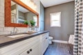 Elegant bathroom interior with tile floor and gray walls. Royalty Free Stock Photo