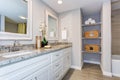 Elegant bathroom with long white vanity cabinet Royalty Free Stock Photo