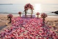 Elegant beach wedding adorned with romantic red and pink roses and petals