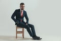 Elegant bearded guy in suit with glasses looking away Royalty Free Stock Photo