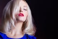 Elegant beautiful women blonde with red lips in a blue dress in the Studio Royalty Free Stock Photo