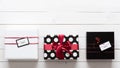 Elegant and beautifully wrapped black, red and white christmas presents