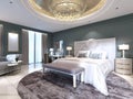 Elegant bedroom interior with large comfortable bed and sofa with dressing table Royalty Free Stock Photo