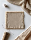 Elegant Beige Fabric and Sewing Essentials on Table Royalty Free Stock Photo