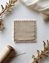 Elegant Beige Fabric and Sewing Essentials on Table Royalty Free Stock Photo