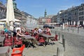 The elegant Belgian city of Mons. A sunny spring day with tourists relaxing at a pavement cafe.