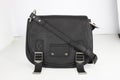 Elegant black bag for official use with mini black pouch for makeup and other essentials with white background