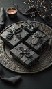 Elegant black gift boxes with ornate decorations on decorative tray Royalty Free Stock Photo