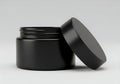 Elegant black jar with matching lid displayed on a plain background Royalty Free Stock Photo