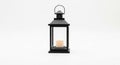 Elegant Black Lantern with a Lit Candle Inside, Isolated on White Background Royalty Free Stock Photo