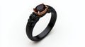 Elegant black ring with a red gemstone placed on a white isolate background Royalty Free Stock Photo