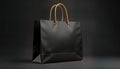 Elegant black shopping bag with gold handles. Stylish, sophisticated accessory. Luxury retail product. Modern design. Perfect for