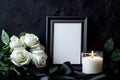 Elegant black and white memorial setting with roses, a candle, and an empty frame for remembrance. Royalty Free Stock Photo