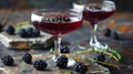 Elegant Blackberry Cocktails Garnished with Fresh Herbs