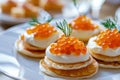 Elegant Blini Pancakes with Salmon Roe, Gourmet Appetizer Concept Royalty Free Stock Photo