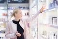 Beautiful woman shopping in beauty store. Royalty Free Stock Photo