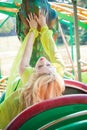 Elegant blonde fashion woman in amusement park summer day Royalty Free Stock Photo