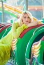 Elegant blonde fashion woman portrait in amusement park summer Royalty Free Stock Photo