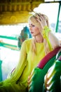 Elegant blonde fashion woman portrait in amusement park summer Royalty Free Stock Photo