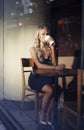 Elegant blonde woman drinking coffee Royalty Free Stock Photo