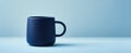 The elegant blue ceramic mug stands out in minimalist design setting..AI generated image Royalty Free Stock Photo