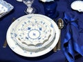 Elegant blue table setting with fine dinnerware Royalty Free Stock Photo