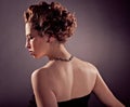 Elegant bosomy mature woman in black tight dress Royalty Free Stock Photo