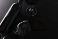 Elegant bottle and wineglasses of red wine with dark chocolate on black background. Top view. Concept of advertising and promotion Royalty Free Stock Photo