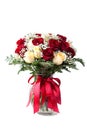 Elegant bouquet of red, white roses, decorated with fern leaves, ribbons, flowers clear vase white Royalty Free Stock Photo