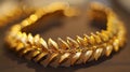 Gold bracelet featuring leaf design