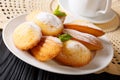 Elegant breakfast: Madeleine cookies with mint and tea close-up. horizontal