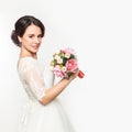 Elegant bride on a light background. Beautiful wedding bouquet in a bride hands. free space for your text Royalty Free Stock Photo