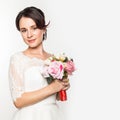 Elegant bride on a light background. Beautiful wedding bouquet in a bride hands. free space for your text Royalty Free Stock Photo