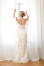 Elegant Bride Opening Window