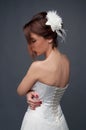 Elegant bride with short hair updo and bare shoulders dress