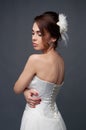 Elegant bride with short hair updo and bare shoulders dress