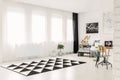 Elegant bedroom interior with copy space and black and white patterned rug on the floor