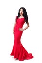 Elegant brunette girl in a black curly hair in a red evening dress. Isolated on white background Royalty Free Stock Photo