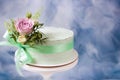 Elegant cake decorated fresh roses on vintage stand.Green ribbon with tied bow. Wedding cake, birthday cake, Mother`s day, 8